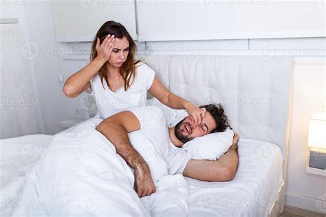 Couple In Bed Man Snoring And Woman Cant Sleep Snoring Man And Young Woman Couple Sleeping