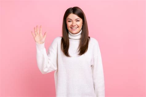 Premium Photo Portrait Of Smiling Pretty Female Looking And Waving