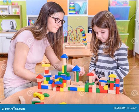 Kindergarten Teacher Supporting Sad Child Stock Image Image Of Center