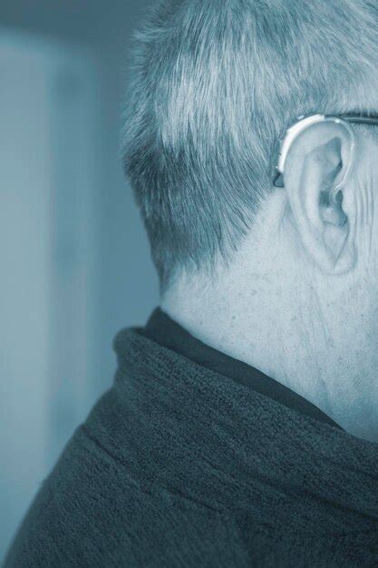 Premium Photo Close Up Of Man Wearing Hearing Aid