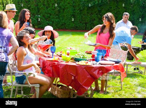 Family eating together outdoors Stock Photo - Alamy