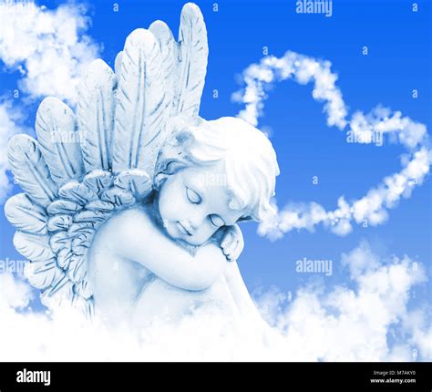 Dreaming Angel In Front Of Cloud Heart Stock Photo Alamy