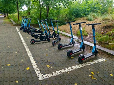 Scooter Parking Lot On The Pedestrian Walking Area Specially Marked For