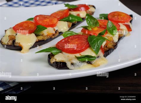 Baked Eggplant With Tomato And Basil And Cheese Stock Photo Alamy