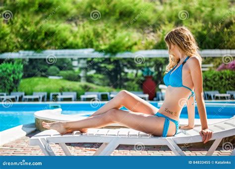 Woman Wearing Blue Bikini Relax On Beach Chaise Longue Stock Image