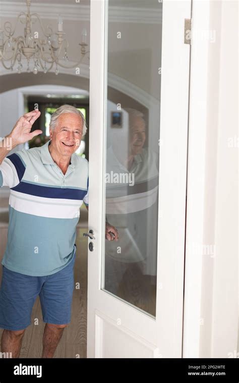 Portrait Of Happy Caucasian Senior Man Looking At Camera And Greeting