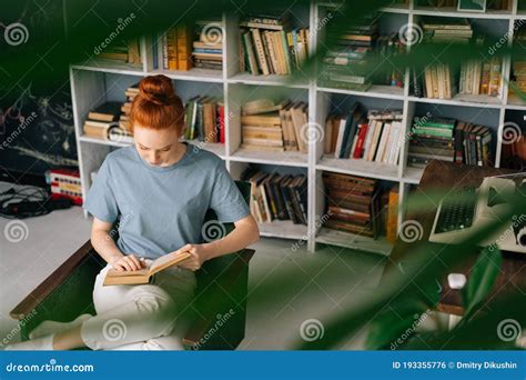 Beautiful Redhead Young Woman Student Is Reading Book Enjoys Of Rest At