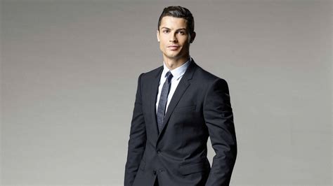 Download CR7 HD Dashing Black Suit Wallpaper | Wallpapers.com