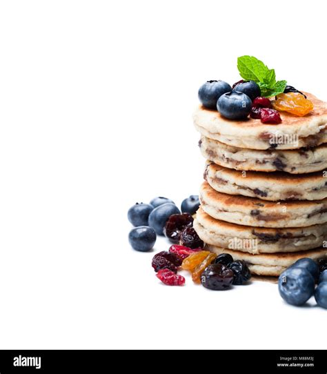 Stack Of Welsh Cakes With Dry Berries And Fresh Blueberries Isolated On