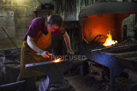 Blacksmith Striking Red Hot Metal Apron Horizontal Stock Photo 128235446