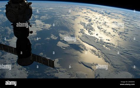 The Silhouetted Soyuz Ms Crew Ship Docked To The Prichal Docking