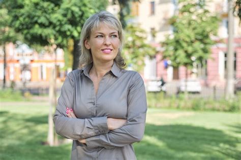 Premium Photo Outdoor Portrait Of Positive Mature Middle Aged Woman