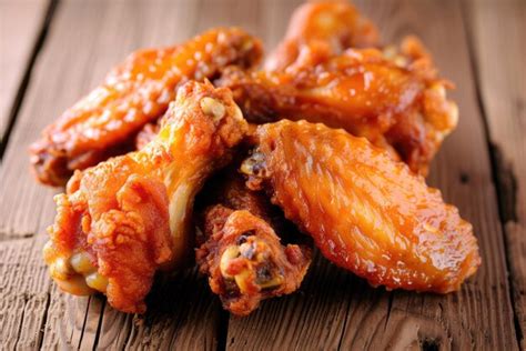 Premium Photo Crispy Fried Chicken Wings On Wooden Table