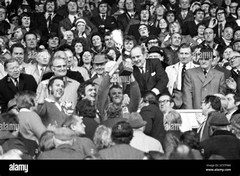 Llanelli Captain Roy Shunto Thomas Holds The WRU Cup Aloft After