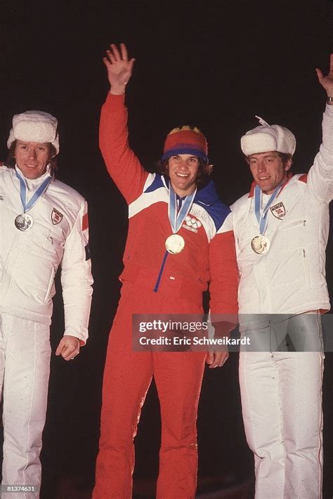 Winter Olympics, USA Eric Heiden victorious with gold medal on stand ...