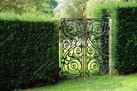 Black wrought iron garden gate — Stock Photo © ronyzmbow #9122076