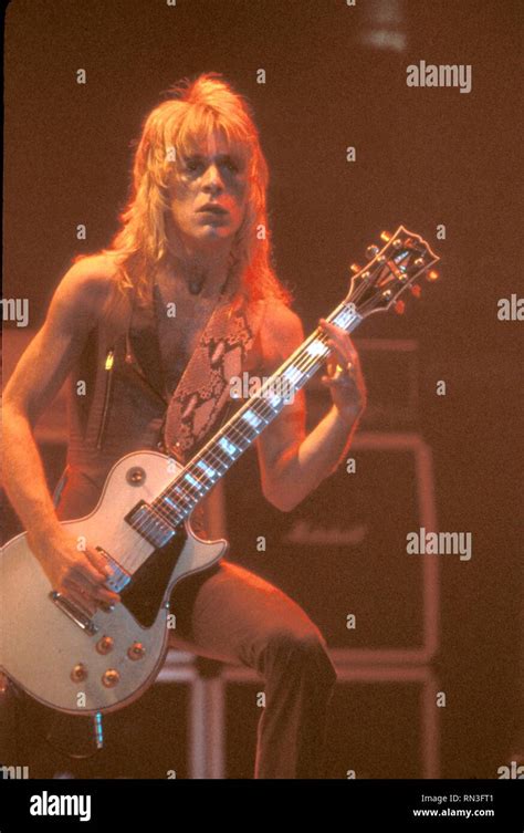 Guitarist Randy Rhoads is shown performing on stage during an Ozzy ...