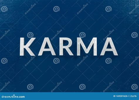 The Word Karma On Classic Blue Background On Center Of Picture Stock