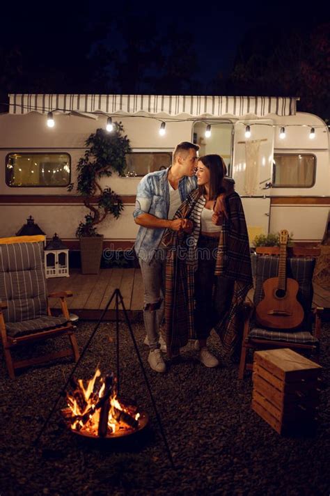 Young Love Couple Kissing By The Campfire Camping Stock Image Image Of Campingcar Fire