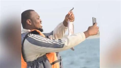 Man Takes Selfie With Fish Throws His Phone Into The Water By Mistake