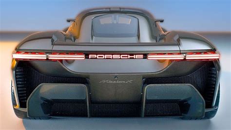 The Rear End Of A Sports Car With Its Lights On