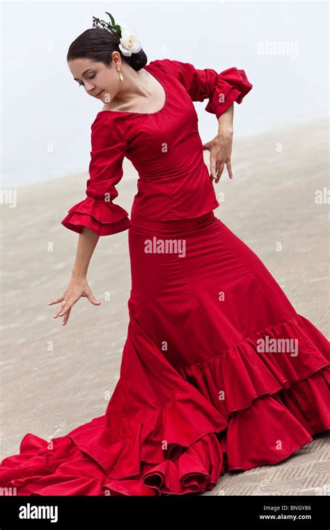 Woman Traditional Spanish Flamenco Dancer Dancing In A Red Dress Stock