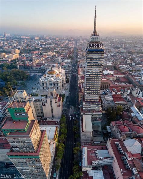 An Aerial View Of A City With Tall Buildings In The Foreground And A