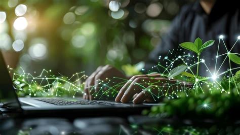 Premium Photo | Businessman using laptop to reduce companys carbon ...