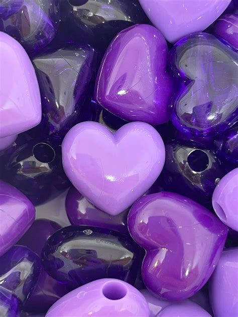 Purple Heart Shaped Beads Are Shown In Close Up