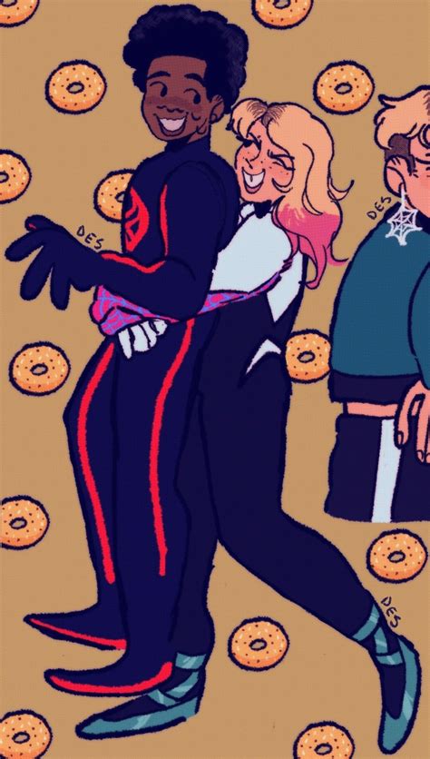 Two People Hugging Each Other In Front Of Donuts