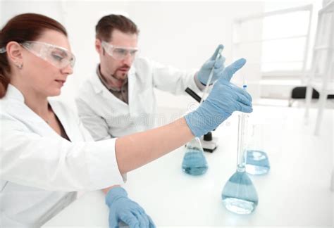 Two Scientists Chemists Conduct Research In The Laboratory Stock Image