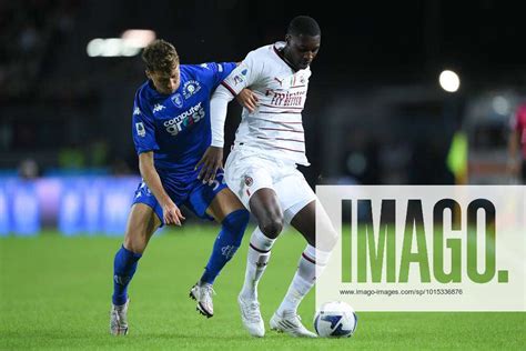 Fode Ballo Toure Of Ac Milan And Nicolas Haas Of Empoli Fc Compete For