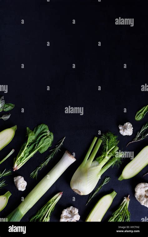 Various Fresh Green Colour Vegetables On Dark Background Knolling