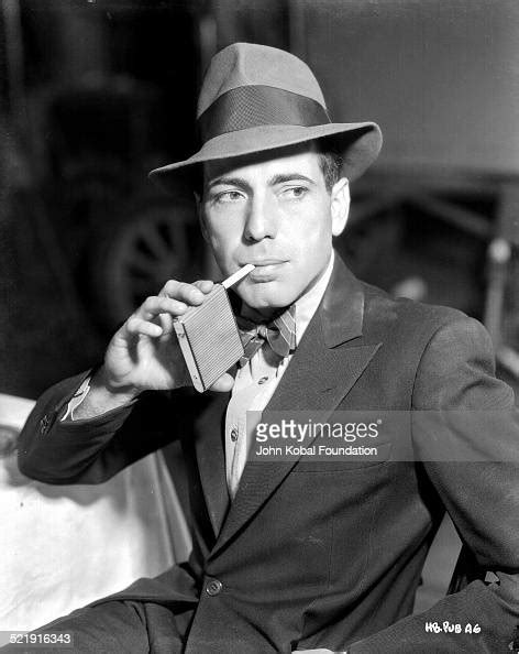 Posed Portrait Of Actor Humphrey Bogart Wearing A Hat And Bow Tie