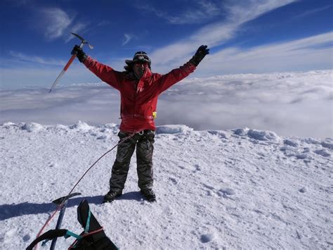 Premium Photo | Full length of woman standing on snow covered mountain