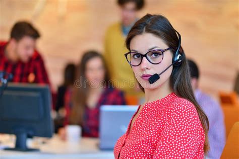 Portrait Of Happy Smiling Female Customer Support Phone Operator At