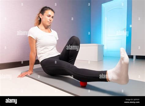 Athletic Caucasian Slim Woman Doing Myofascial Self Massage Of The