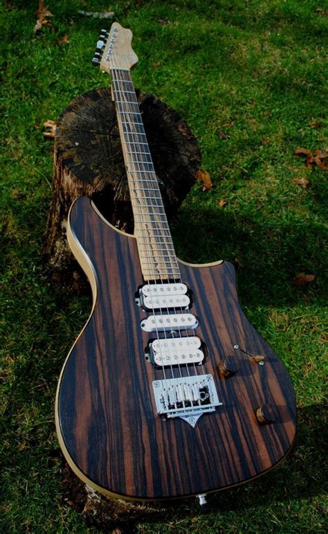 Macassar Ebony Top Black Limba Body With A 24 Fret Pale Moon Ebony Fingerboard White Limba