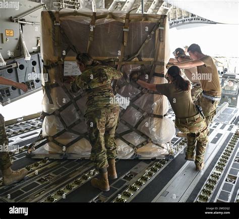 Airmen From The 386th Expeditionary Logistics Readiness Squadron Along