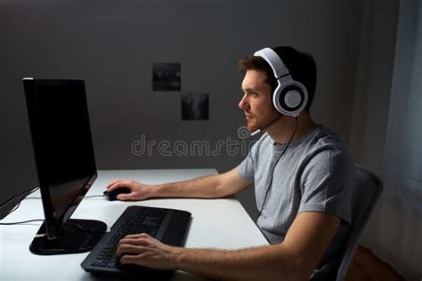 Man in Headset Playing Computer Video Game at Home Stock Photo - Image ...