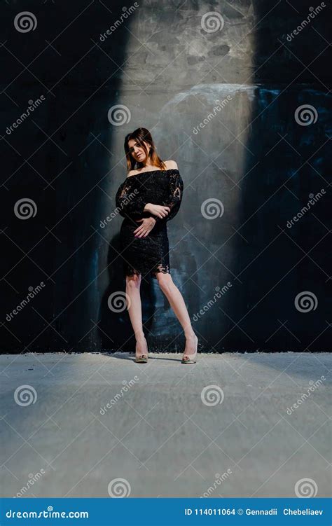 Brunette Posing Near Black Wall In The Studio Stock Photo Image Of Indoor Glamour 114011064