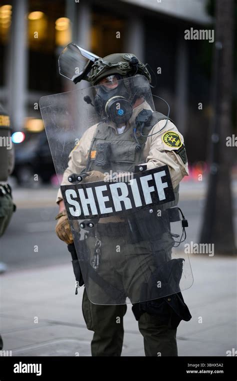 los angeles sheriff deputy   riot shield  gas mask