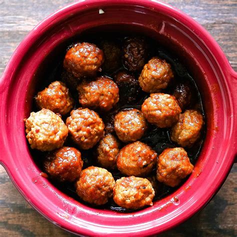 Slow Cooker Sweet And Spicy Meatballs The Thirsty Feast By Honey And