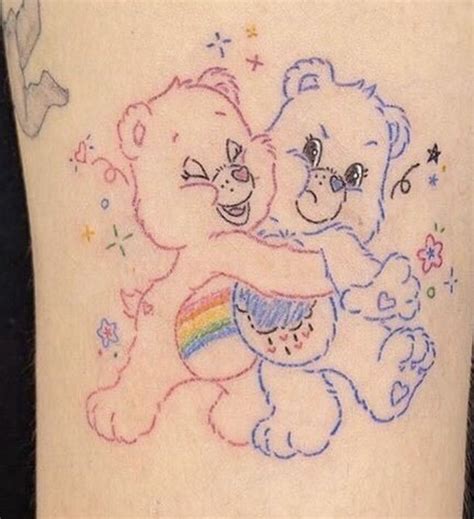 Two Teddy Bears Hugging Each Other With Rainbows And Stars On Their