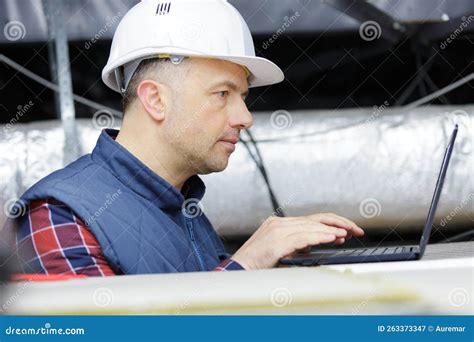 Engineer Working with Laptop in Ceiling Stock Image - Image of male ...