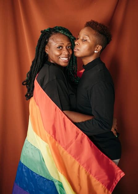 Premium Photo Happy Lesbian Couple With A Colorful Flag