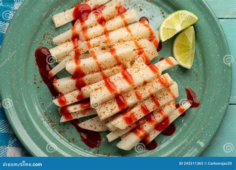 Mexican Yam Bean Also Called Jicama With Chili Powder And Chamoy Sauce