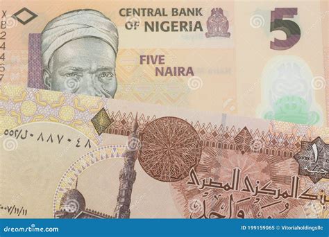 A Orange Plastic Five Naira Note From Nigeria Paired With A One Pound