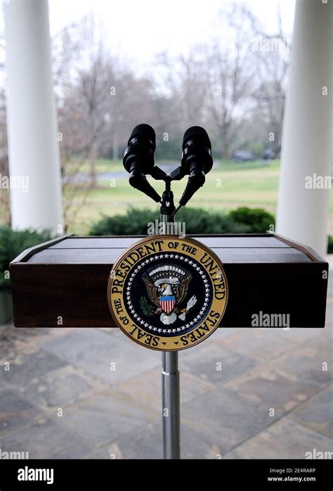 A podium with the seal of the President of the United States stands ...