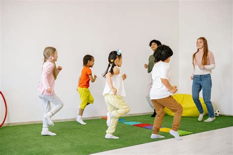 Preschoolers Doing Running Exercise With Their Teachers · Free Stock Photo